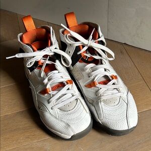 White High-Top Jordan Sneakers with Orange Accents